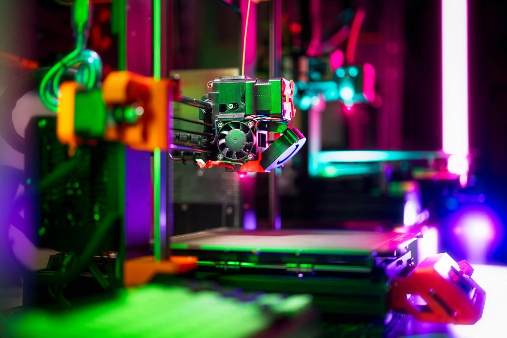 pexels photo 30720497 30720497 Close-up of a neon-colored 3D printer in a workshop, showcasing vibrant technology.